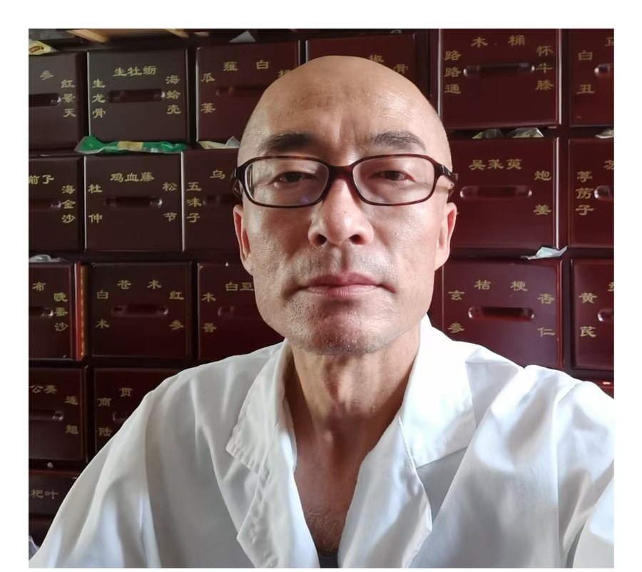 老赵 Lao Zhao — fourth-generation practitioner of Chinese medicine, in his herbal dispensary